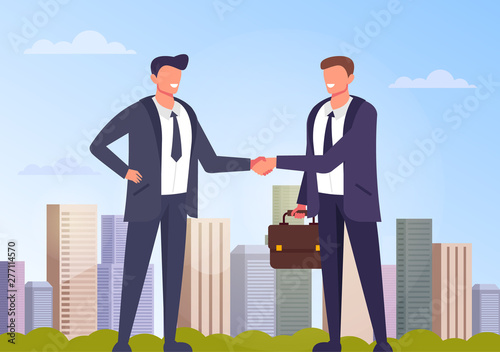 Two businessmen office workers characters shaking hands. Business deal city background concept. Vector flat graphic design cartoon illustration