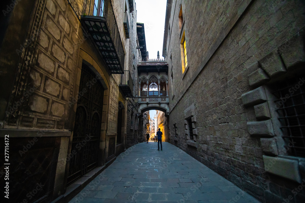 Fototapeta premium Barcelona, Spain - April, 2019: Old streets of the Gothic Quarter of Barcelona, Catalonia is centre of old city of Barcelona. Center of touristic life