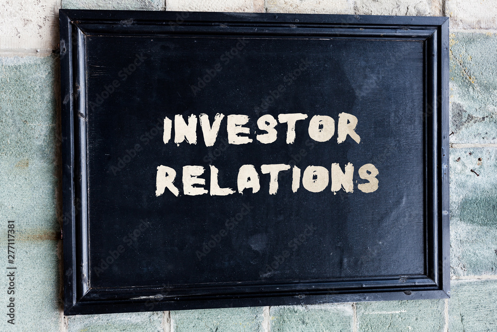 Writing note showing Investor Relations. Business concept for analysisagement responsibility that integrates finance Writing note showing Investor Relations. Business concept for analysisagement responsibility that integrates finance