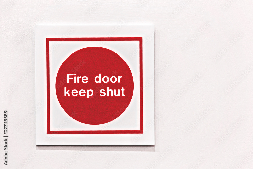 Generic red fire safety sign shot straight on.
