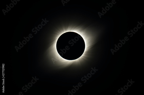 The Solar Corona atmosphere layer during Total Solar Eclipse Chile 2019, amazing view of the Sun covered by the Moon during totality phase while the Moon covers the entire Sun an awesome phenomenom