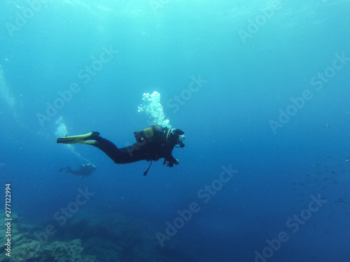 Young female scuba diver in Atlantic ocean