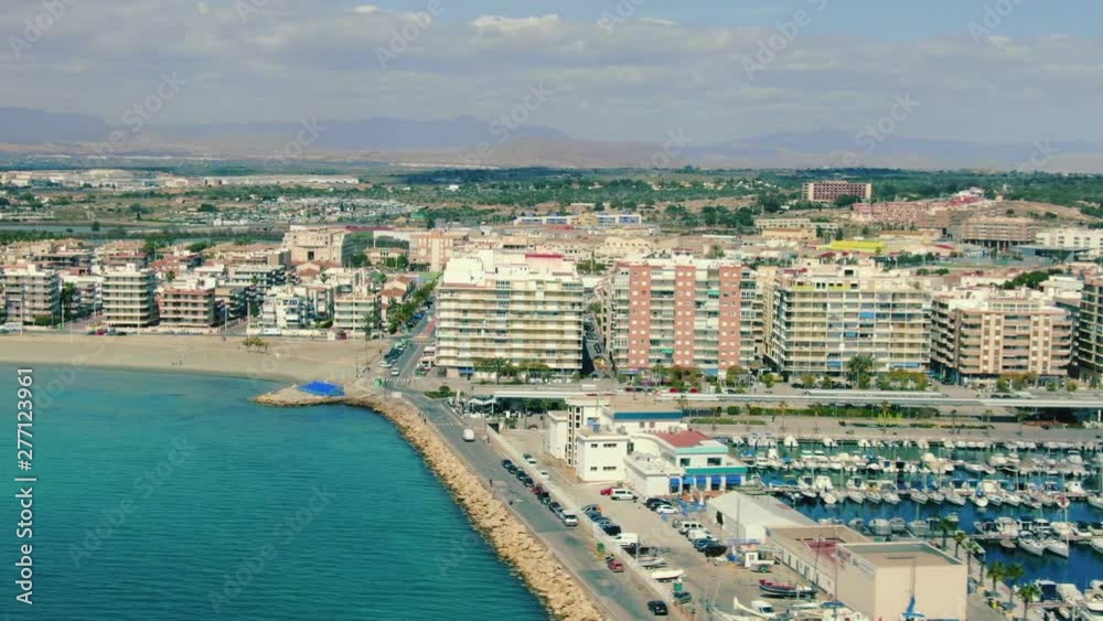 Aerial skyline of coastal city in Spain, waterfront with marina and residential buildings, Santa Pola near Alicante on the Costa Blanca, panoramic view of Mediterranean city Aerial skyline of coastal city in Spain, waterfront with marina and residential buildings, Santa Pola near Alicante on the Costa Blanca, panoramic view of Mediterranean city
