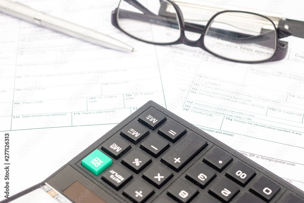 calculator and documents for working on the table, Finance and savings, Business concept. calculator and documents for working on the table, Finance and savings, Business concept.