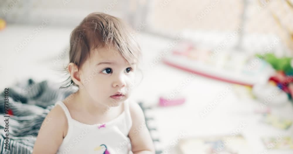 Incredible cute baby girl playing indoors. Shot on a cinema camera in 4K RAW. Incredible cute baby girl playing indoors. Shot on a cinema camera in 4K RAW.