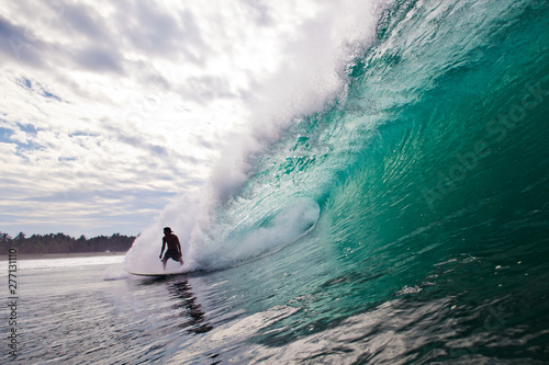 Surfer in a huge wave
