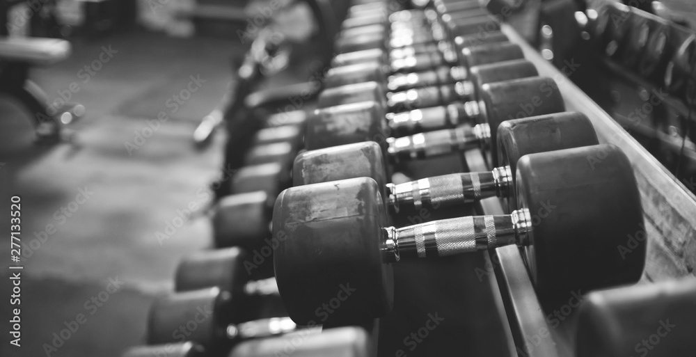 Obraz premium dumbbell rack close-up in the gym