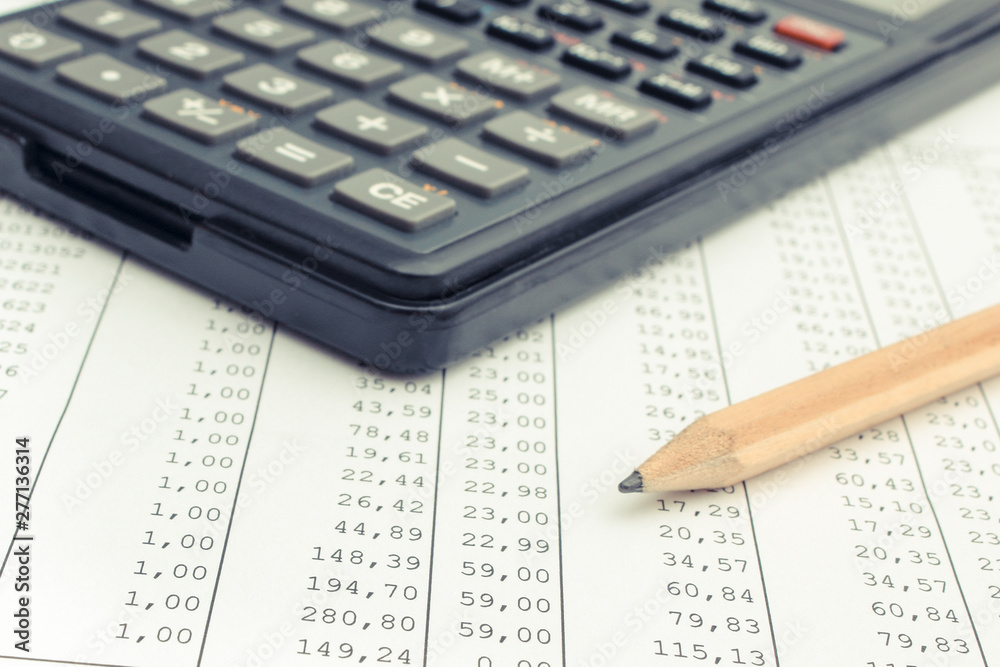 Calculator and pencil on spreadsheet. Business concept Calculator and pencil on spreadsheet. Business concept