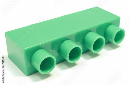 Green toy block for children on white background.
