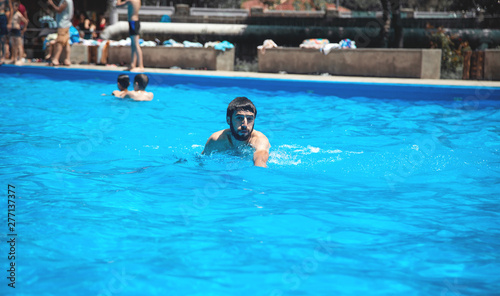 Caucasian man in the swimming pool. © andranik123