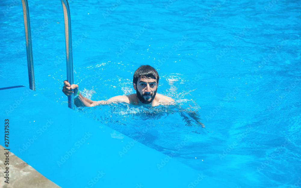 Caucasian man in the swimming pool.