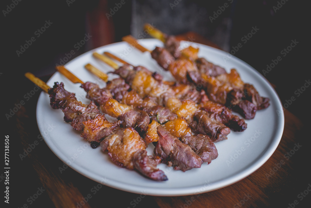 Homemade food of grilled beef meat with rosemary and pepper