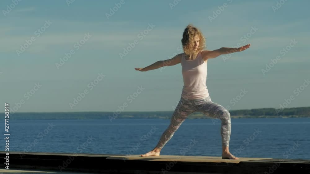 Young woman practicing yoga outdoors in summer. Healthy lifestyle Young woman practicing yoga outdoors in summer. Healthy lifestyle