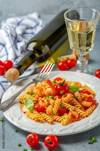 Fusilli pasta with shrimp in tomato sauce.