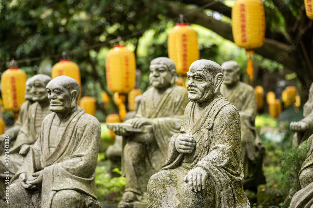 Fototapeta premium groups of buddhist arhat stone statue