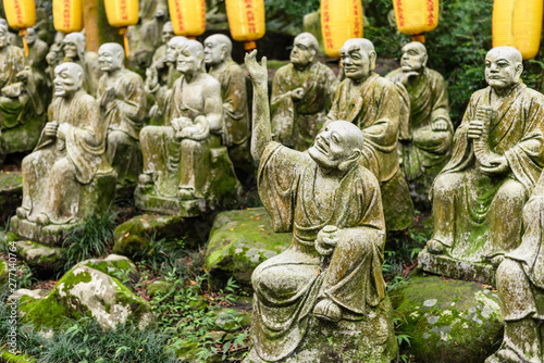 groups of buddhist arhat stone statue photo