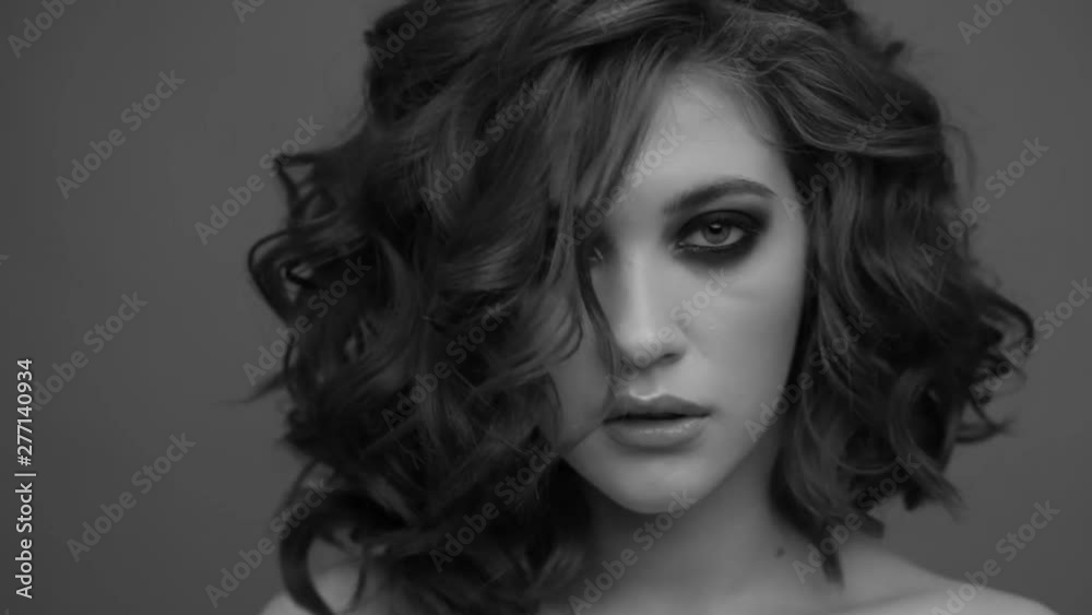 Brunette posing on camera. Black and white video. Emotions girls with a slight flirtation. Brunette posing on camera. Black and white video. Emotions girls with a slight flirtation.