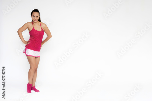 Fototapeta Naklejka Na Ścianę i Meble -  Full-length portrait on white background of beautiful pretty fitness girl woman in pink sport uniform standing exercises in different poses with different emotions. Smiles Stylish trendy youth.