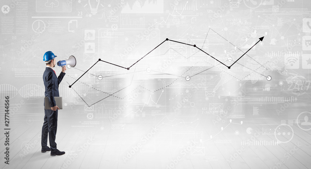 Engineer with construction helmet holding a plan and standing with graphs, charts and reports on the background Engineer with construction helmet holding a plan and standing with graphs, charts and reports on the background