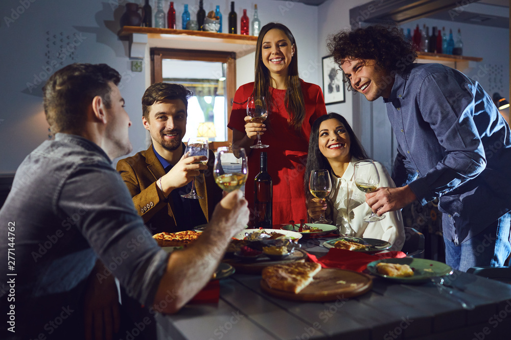 A group of friends at a meeting in a restaurant A group of friends at a meeting in a restaurant