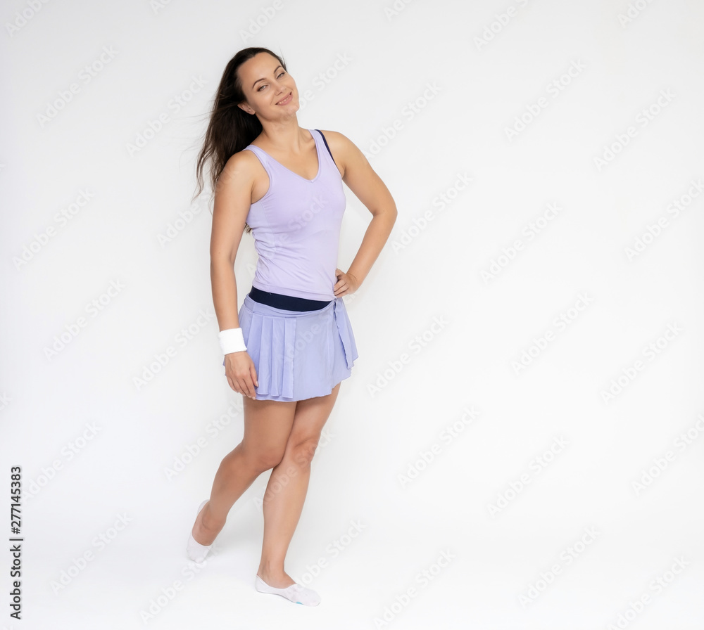Full-length portrait on white background of beautiful pretty fitness girl woman in trendy tennis sport uniform, with different emotions in different poses, shows hands. Smiles. Stylish trendy youth. Full-length portrait on white background of beautiful pretty fitness girl woman in trendy tennis sport uniform, with different emotions in different poses, shows hands. Smiles. Stylish trendy youth.