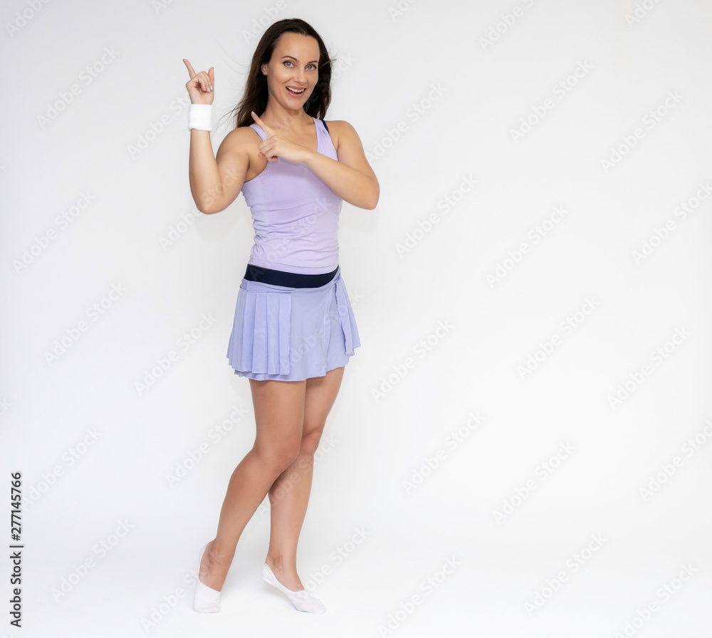 Full-length portrait on white background of beautiful pretty fitness girl woman in trendy tennis sport uniform, with different emotions in different poses, shows hands. Smiles. Stylish trendy youth. Full-length portrait on white background of beautiful pretty fitness girl woman in trendy tennis sport uniform, with different emotions in different poses, shows hands. Smiles. Stylish trendy youth.