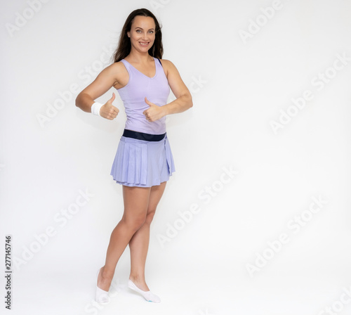 Full-length portrait on white background of beautiful pretty fitness girl woman in trendy tennis sport uniform, with different emotions in different poses, shows hands. Smiles. Stylish trendy youth.