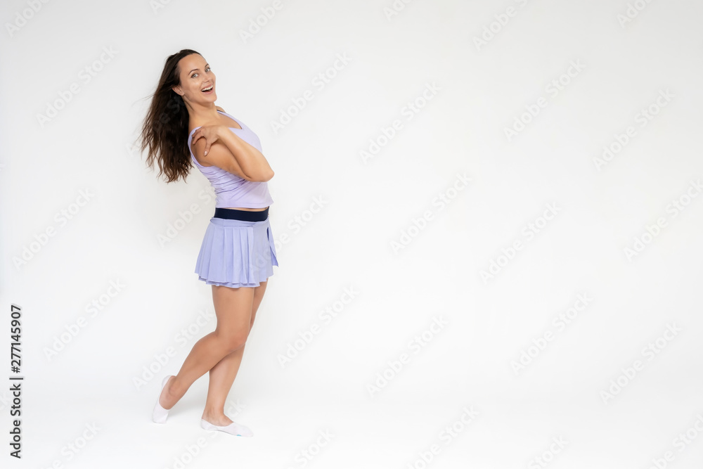 Full-length portrait on white background of beautiful pretty fitness girl woman in trendy tennis sport uniform, with different emotions in different poses, shows hands. Smiles. Stylish trendy youth. Full-length portrait on white background of beautiful pretty fitness girl woman in trendy tennis sport uniform, with different emotions in different poses, shows hands. Smiles. Stylish trendy youth.