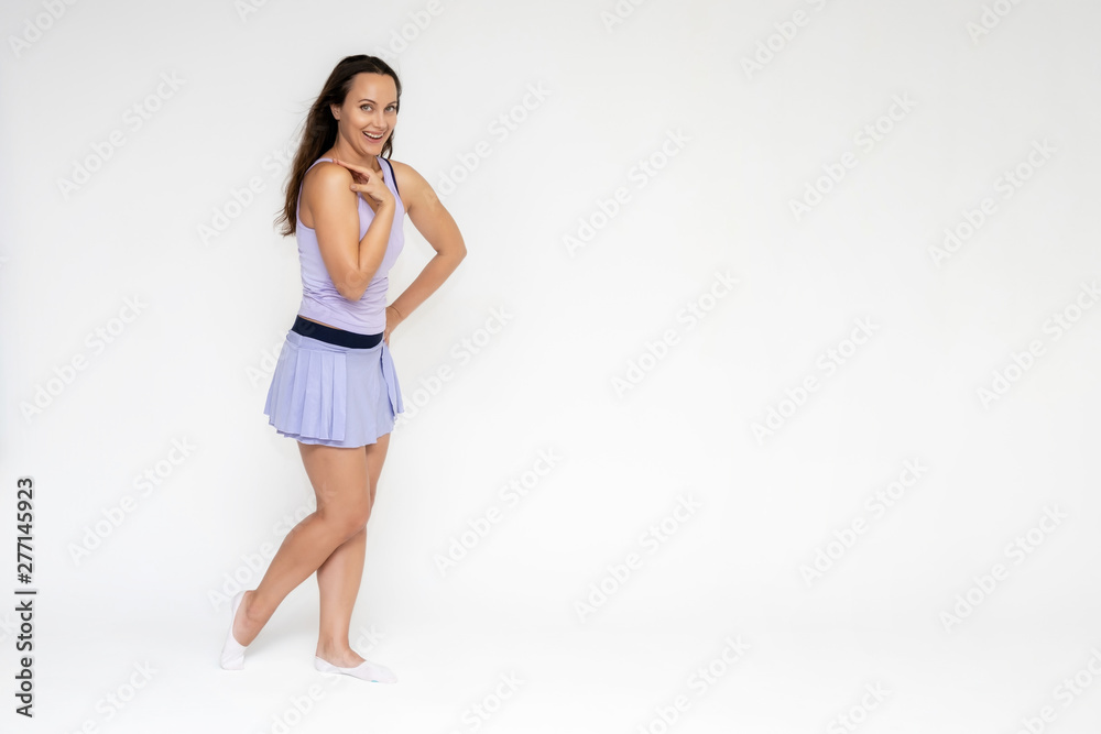 Full-length portrait on white background of beautiful pretty fitness girl woman in trendy tennis sport uniform, with different emotions in different poses, shows hands. Smiles. Stylish trendy youth. Full-length portrait on white background of beautiful pretty fitness girl woman in trendy tennis sport uniform, with different emotions in different poses, shows hands. Smiles. Stylish trendy youth.