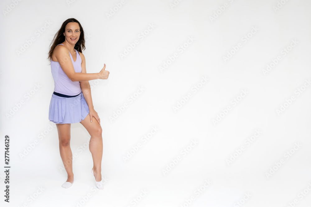 Full-length portrait on white background of beautiful pretty fitness girl woman in trendy tennis sport uniform, with different emotions in different poses, shows hands. Smiles. Stylish trendy youth. Full-length portrait on white background of beautiful pretty fitness girl woman in trendy tennis sport uniform, with different emotions in different poses, shows hands. Smiles. Stylish trendy youth.