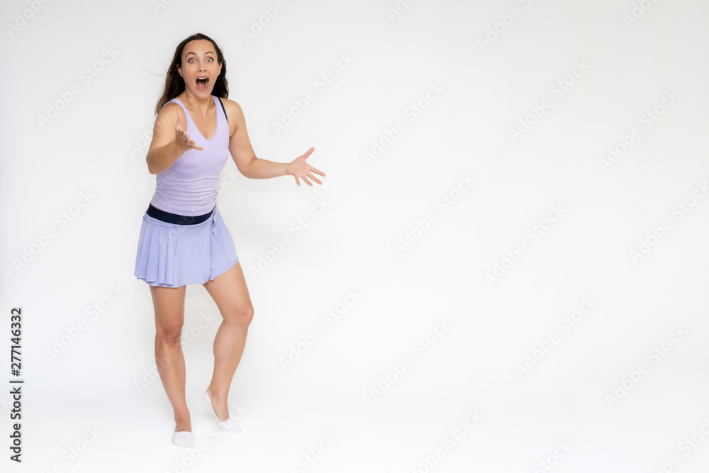 Full-length portrait on white background of beautiful pretty fitness girl woman in trendy tennis sport uniform, with different emotions in different poses, shows hands. Smiles. Stylish trendy youth. Full-length portrait on white background of beautiful pretty fitness girl woman in trendy tennis sport uniform, with different emotions in different poses, shows hands. Smiles. Stylish trendy youth.