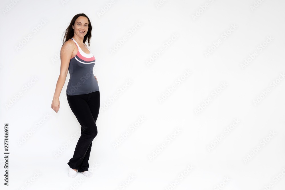 Full-length portrait on white background of beautiful pretty fitness girl woman in sports uniform, standing with different emotions in different poses, showing hands. Smiles Stylish trendy youth.