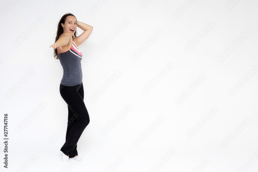 Full-length portrait on white background of beautiful pretty fitness girl woman in sports uniform, standing with different emotions in different poses, showing hands. Smiles Stylish trendy youth.