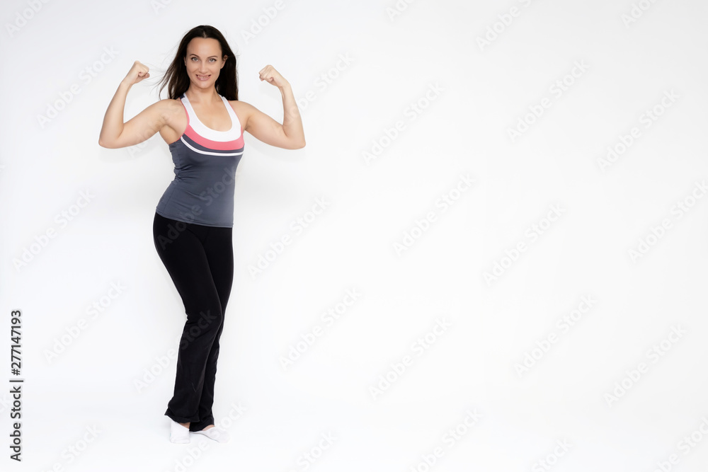 Full-length portrait on white background of beautiful pretty fitness girl woman in sports uniform, standing with different emotions in different poses, showing hands. Smiles Stylish trendy youth. Full-length portrait on white background of beautiful pretty fitness girl woman in sports uniform, standing with different emotions in different poses, showing hands. Smiles Stylish trendy youth.