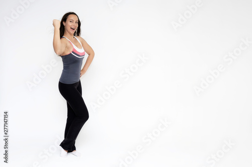 Full-length portrait on white background of beautiful pretty fitness girl woman in sports uniform, standing with different emotions in different poses, showing hands. Smiles Stylish trendy youth.