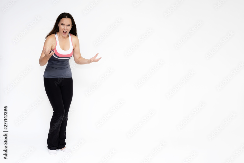 Full-length portrait on white background of beautiful pretty fitness girl woman in sports uniform, sitting on the stairs with different emotions in different poses. Stylish trendy youth. Full-length portrait on white background of beautiful pretty fitness girl woman in sports uniform, sitting on the stairs with different emotions in different poses. Stylish trendy youth.