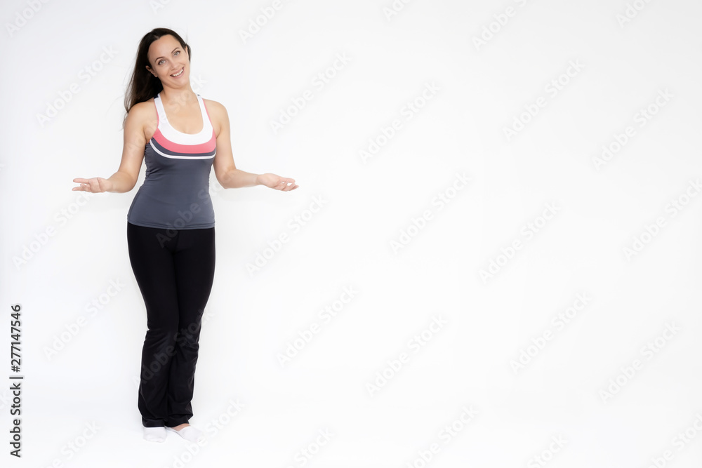 Full-length portrait on white background of beautiful pretty fitness girl woman in sports uniform, sitting on the stairs with different emotions in different poses. Stylish trendy youth. Full-length portrait on white background of beautiful pretty fitness girl woman in sports uniform, sitting on the stairs with different emotions in different poses. Stylish trendy youth.