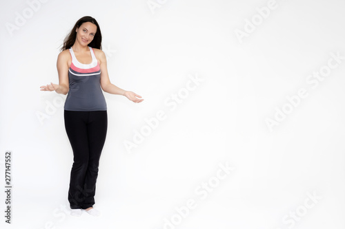 Full-length portrait on white background of beautiful pretty fitness girl woman in sports uniform, sitting on the stairs with different emotions in different poses. Stylish trendy youth.