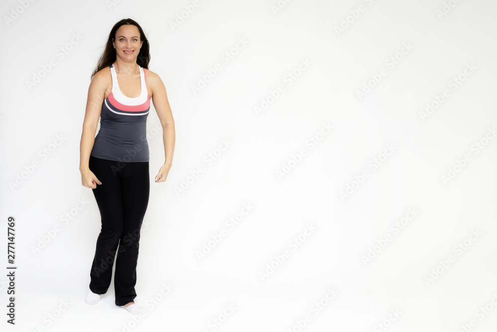 Full-length portrait on white background of beautiful pretty fitness girl woman in sports uniform, sitting on the stairs with different emotions in different poses. Stylish trendy youth. Full-length portrait on white background of beautiful pretty fitness girl woman in sports uniform, sitting on the stairs with different emotions in different poses. Stylish trendy youth.