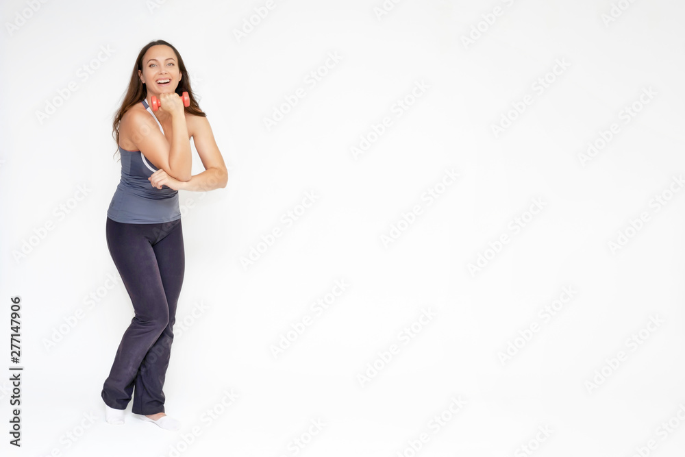 Full-length portrait on white background of beautiful pretty fitness girl woman in sports uniform, sitting on the stairs with different emotions in different poses. Stylish trendy youth. Full-length portrait on white background of beautiful pretty fitness girl woman in sports uniform, sitting on the stairs with different emotions in different poses. Stylish trendy youth.