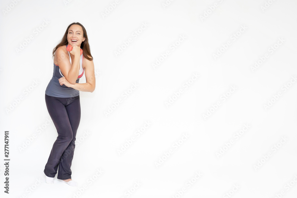 Full-length portrait on white background of beautiful pretty fitness girl woman in sports uniform, sitting on the stairs with different emotions in different poses. Stylish trendy youth. Full-length portrait on white background of beautiful pretty fitness girl woman in sports uniform, sitting on the stairs with different emotions in different poses. Stylish trendy youth.