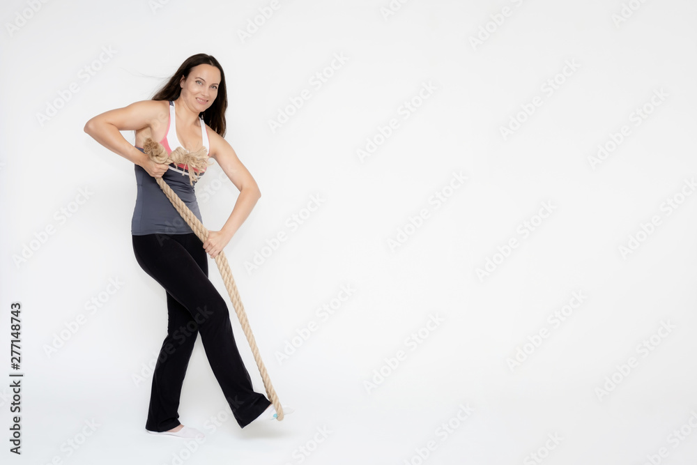Fototapeta premium Full-length portrait on white background of beautiful pretty fitness girl woman in sport uniform with rope in hands, with different emotions in different poses. Stylish trendy youth.