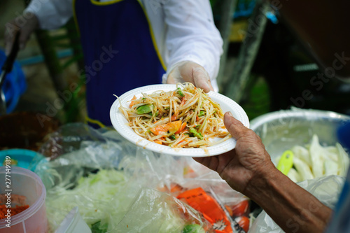 Free food for poor and homeless people donates food to food less people : The poor have been sharing food from the kinder society to Relieve Hunger : Social concept of poor people sharing