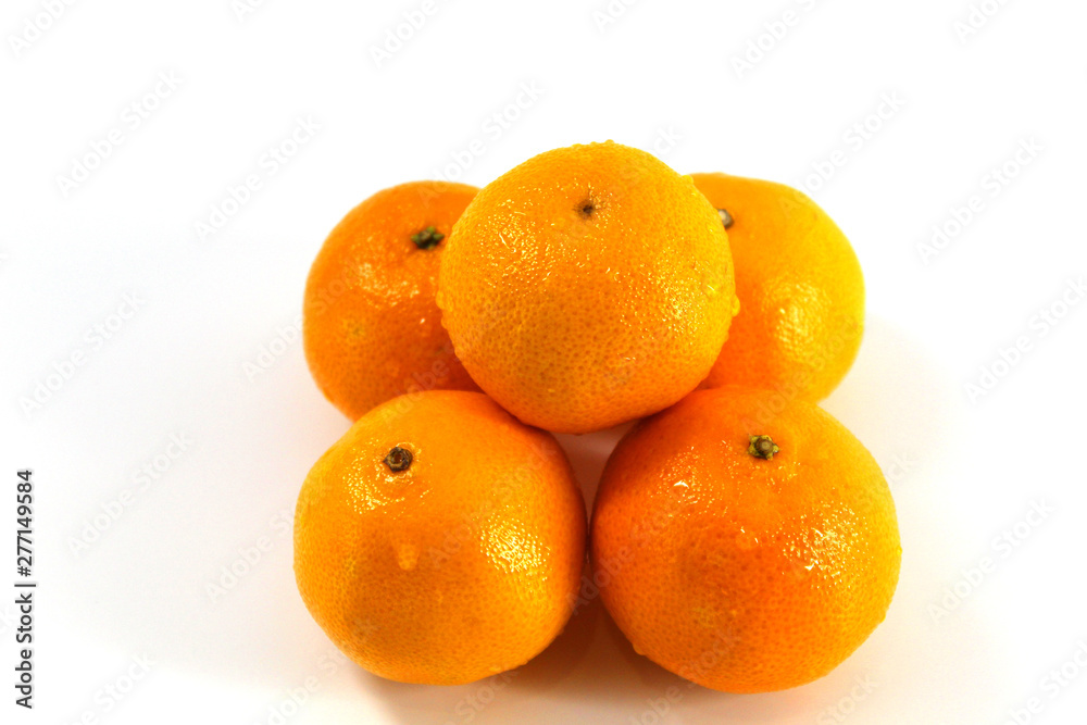 On a white background tangerines - fresh, clean, with water drops On a white background tangerines - fresh, clean, with water drops