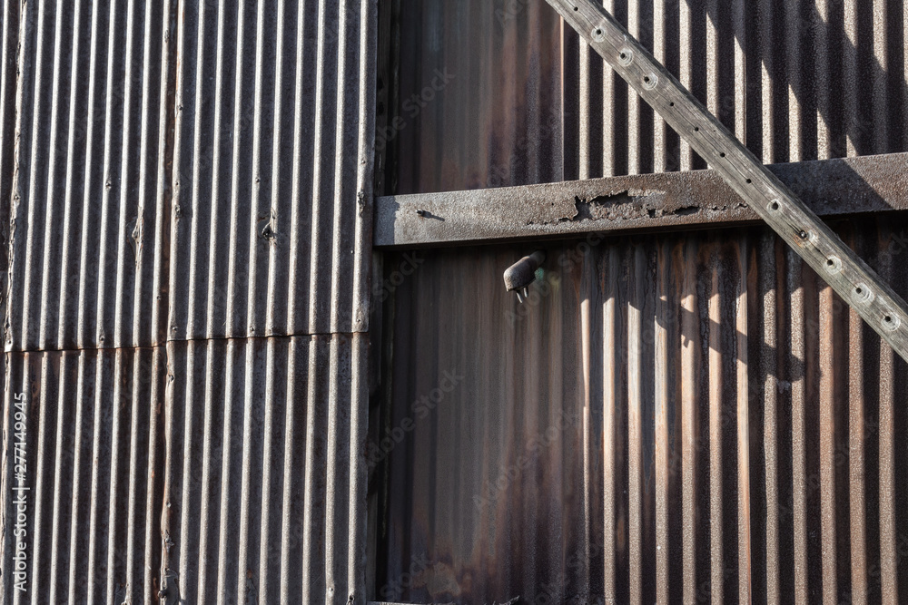 Background of corrugated metal, rusty metal patina, horizontal aspect Background of corrugated metal, rusty metal patina, horizontal aspect