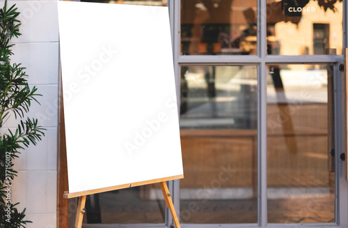 Billboards or White promotion poster displayed on the front of the restaurant, coffee shop Promotion information for marketing announcements and details photo