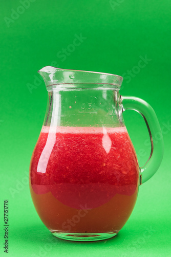 Wallpaper Mural Jug with Fresh Summer Refreshing Watermelon Juice on Green Pastel Background Torontodigital.ca