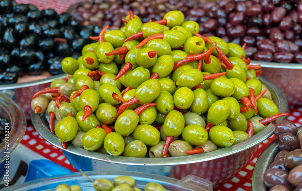 Marinated olives with red chili inside sold on farmers market