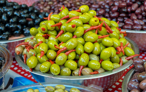 Marinated olives with red chili inside sold on farmers market