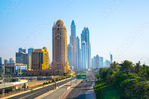 Dubai, UAE United Arabs Emirates.  Arjaan building and Dubai marina skyscrapers at the background. King Salman Al Saud highway view. Hotels and office buildings of UAE